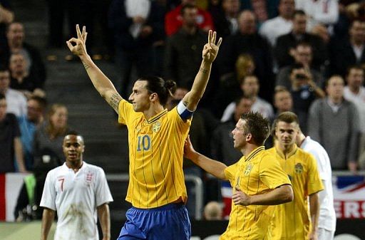Sweden's Zlatan Ibrahimovic (C) celebrates with his teammates after scoring his 3rd goal